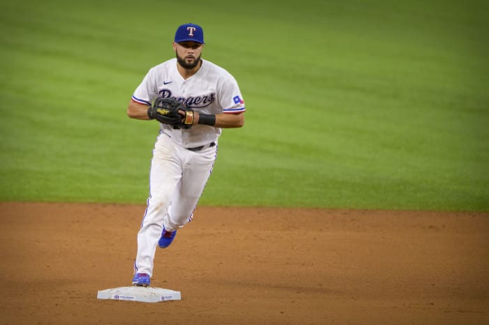 Jun 19, 2021; Arlington, Texas, USA; Texas Rangers shortstop Isiah Kiner-Falefa (9) makes a force out against the Minnesota Twins during the fourth inning at Globe Life Field. Mandatory Credit: Jerome Miron-USA TODAY Sports